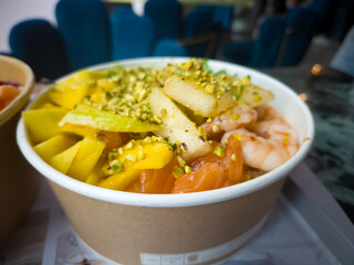 Colorful Poke Bowl Served on a Table with Fresh Ingredients