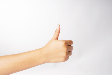 A clenched hand with red-painted nails and the thumb open against a white background