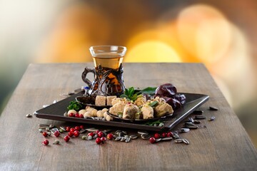 Traditional plate with sweet date fruits and tea
