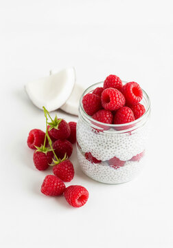 AIP Coconut Milk Chia Pudding with Raspberries &ndash; Grain-Free Dairy-Free Healthy Breakfast Jar on White Background 