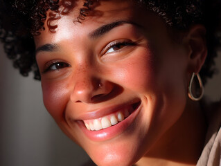 Close-up portrait of a young woman smiles, with large round earrings, captivating brown eyes, shows emotions of calm, fun and carelessness, happiness and joy, on white background