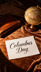 A columbus day still life featuring a globe, old book, and a handwritten card on a velvet surface