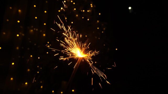 Christmas sparklers candle burns in Christmas tree background. Celebration, Success, New Years Concept.
