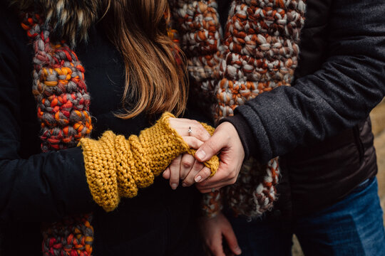 Romantic connection and emotional bonding. A couple holding hands symbolizing love, attachment and healthy relationships. St. Valentine background. No faces.