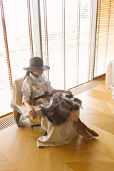 A mysterious woman in an eclectic, avant-garde look combines western and glam styles.