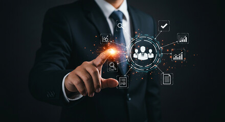 A man in a suit interacting with a digital interface displaying business related icons and graphics