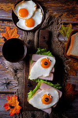 Sandwich with ham and fried egg in the form of ghost for Halloween holidays