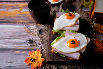 Sandwich with ham and fried egg in the form of ghost for Halloween holidays