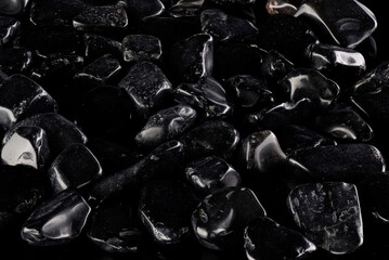 Black polished stones texture background