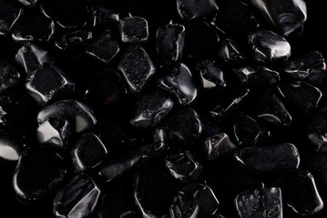 Black polished stones texture background