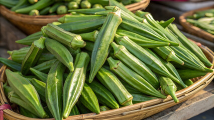 Obraz premium Fresh green okra pods are piled together in a vibrant, tightly packed arrangement, showcasing their crisp, velvety texture and bright emerald hue