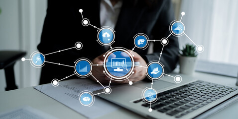 A business professional engages with digital analytics and data visualization on a mobile device while working in a modern office, showcasing technology and strategy. Crux