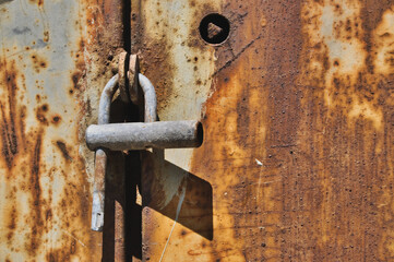 rusty metal door old broken padlock lock close-up
