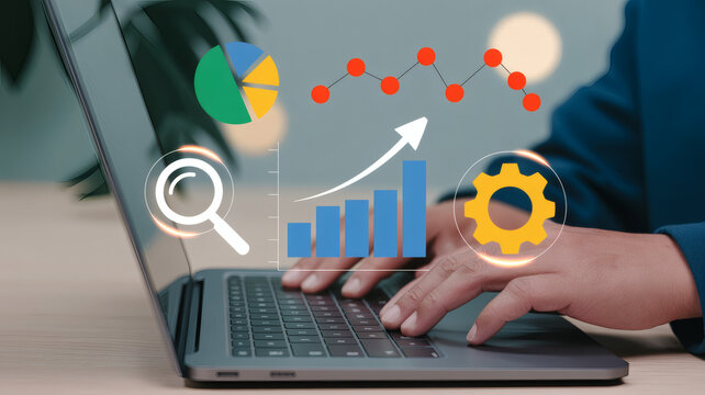 Close up of hands typing on a laptop with digital analytics graphs and charts overlayed representing data analysis and business growth
