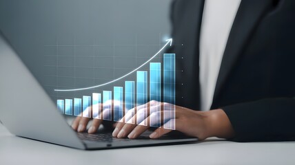 Business professional analyzing financial growth chart on laptop computer