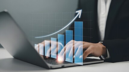 Business growth and financial success shown on laptop with rising graph