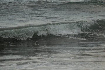 waves breaking on the rocks