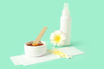 Composition with sugaring paste on turquoise background. Epilation concept