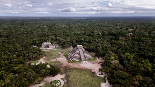 Short orbit shot around the Temple of Kukulcan at Chichen Itza in Yucatan, Mexico, surrounded by dense tropical jungle