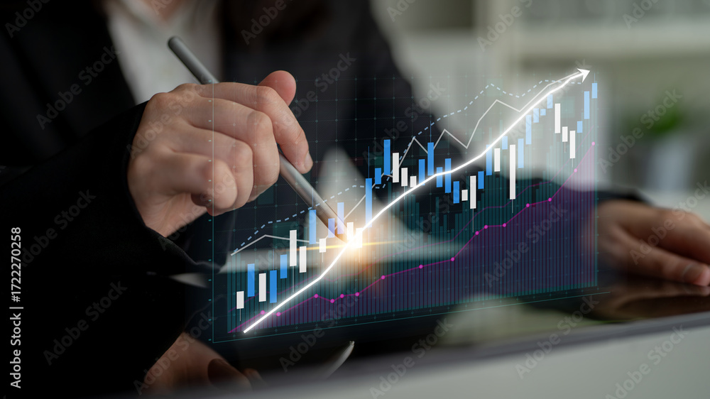 Aufkleber a business professional focuses on digital financial graphs and charts, analyzing trends and data to