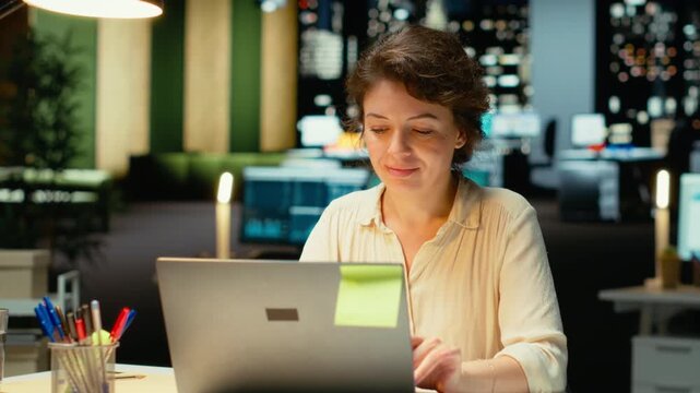 Employee proofreading and fact checking financial data, reviewing archived documents after hours in the strategy room. Evaluating numbers on reports, researching and organizing agenda. Camera B.