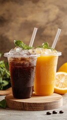 Fototapeta premium Refreshing iced beverages in clear cups, perfect for hot summer days. Enjoy the vibrant flavors of coffee and citrus in this enticing setup featuring mint leaves. Ideal for food and drink enthusiasts 