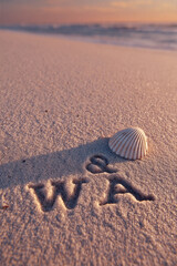 W and A Initials Engraved into Pale Beige Sand with Clean Grooves and Serene Beach Glow – ideal for personalized wall prints