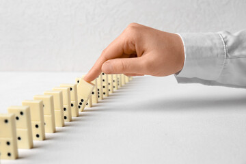 Woman getting out domino from row on white background