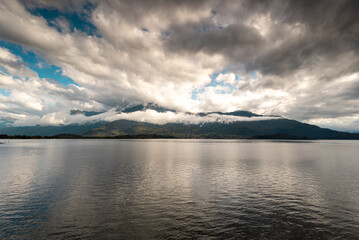 Rain clouds over the mountain and lake Como