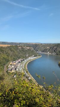 Panoramic view from Maria Ruh in Urbar over the Rhine Valley with vineyards, showing Sankt Goar, Sankt Goarshausen with Katz Castle, the Loreley Rock and the Loreley Plateau.