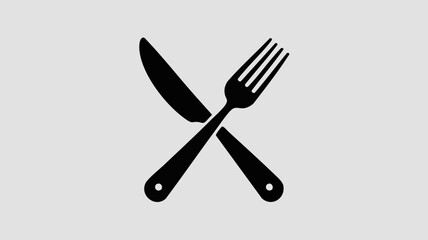 Fototapeta premium A black knife and fork crossed on a light grey background, symbolizing dining, a restaurant, or a meal.