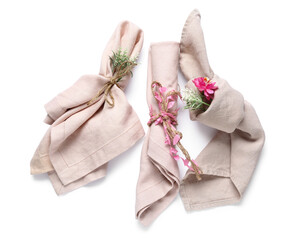 Beige napkins with flowers isolated on white background