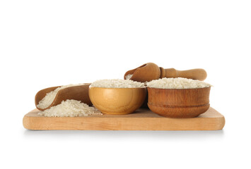 Bowls and wooden scoops with raw rice on white background