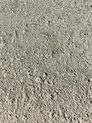 asphalt road construction has some smooth parts and holes, portrait shots