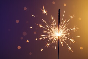 Close up glittering New Years fireworks sparkler trail against smooth gradient backdrop with elegant copy space for festive design
