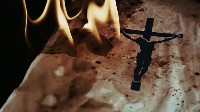 Christian Symbol Jesus Cross on an Old Ancient Parchment in Hell Fire Burning Flames