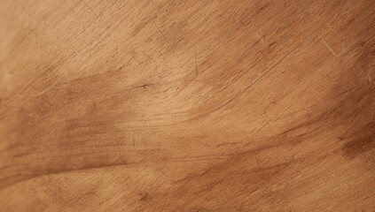 Fototapeta premium A close-up view of a light brown wooden surface, displaying subtle grain patterns and visible marks.