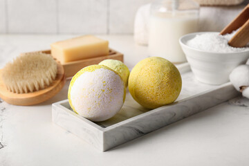 Composition with tray and bath bombs on marble background, closeup