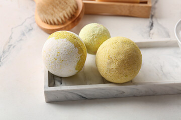 Composition with tray and bath bombs on marble background, closeup