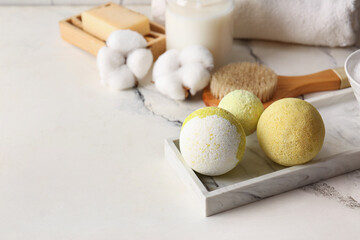 Composition with tray and bath bombs on marble background, closeup