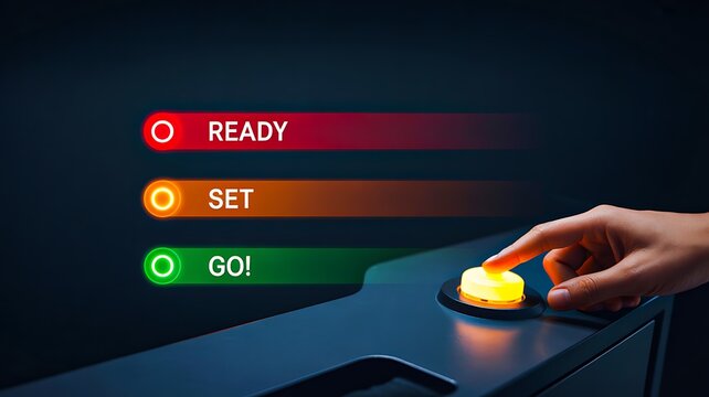 Hand pressing start button with ready set go indicator lights