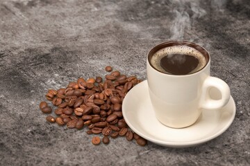 Hot coffee cup and aroma coffee beans