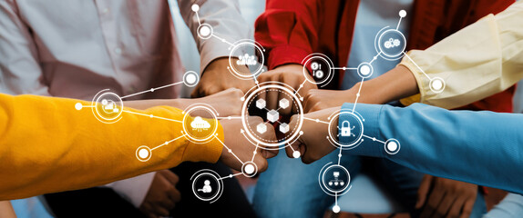 Startup company employee team stacking hand together symbolize successful group of business partnership and strong collective unity teamwork in community workplace in panoramic banner. Synergic Amity