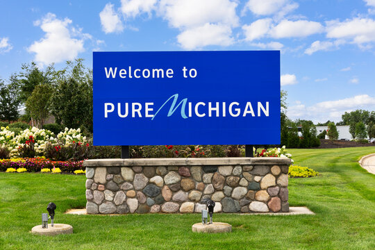 Grand Rapids, MI, USA - August 29, 2025: A welcome to Pure Michigan sign outside of the Gerald Ford Airport as travelers leave the airport.