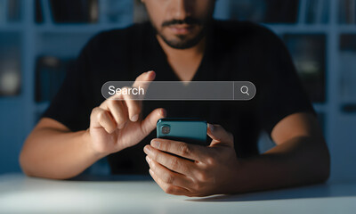 Man Using Smartphone with Search Bar Overlay for Online Information Access