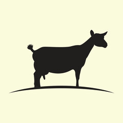 Vector art of silhouette of a goat standing on a curved line against a pale yellow background