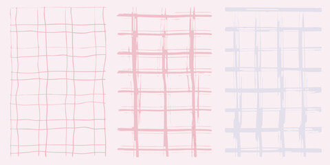 Three vertical hand drawn plaid patterns in soft pink and light blue on a pale pink background