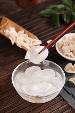Changbaishan White Jade Mushroom Dried Specialty Asian Cuisine Preparation with Chopsticks