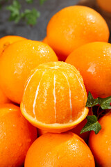 Fresh Juicy Oranges with Water Droplets and Mint Leaves - Healthy Citrus Fruit Collection