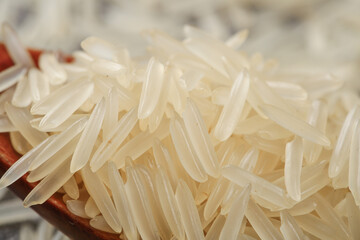 Raw Long Grain Fragrant Rice in Wooden Bowl Close-up Food Photography